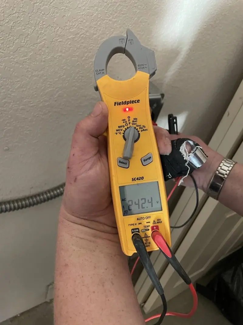 Voltage testing with clamp meter during Hot Tub / Pool Electrical Wiring in Cedar Falls